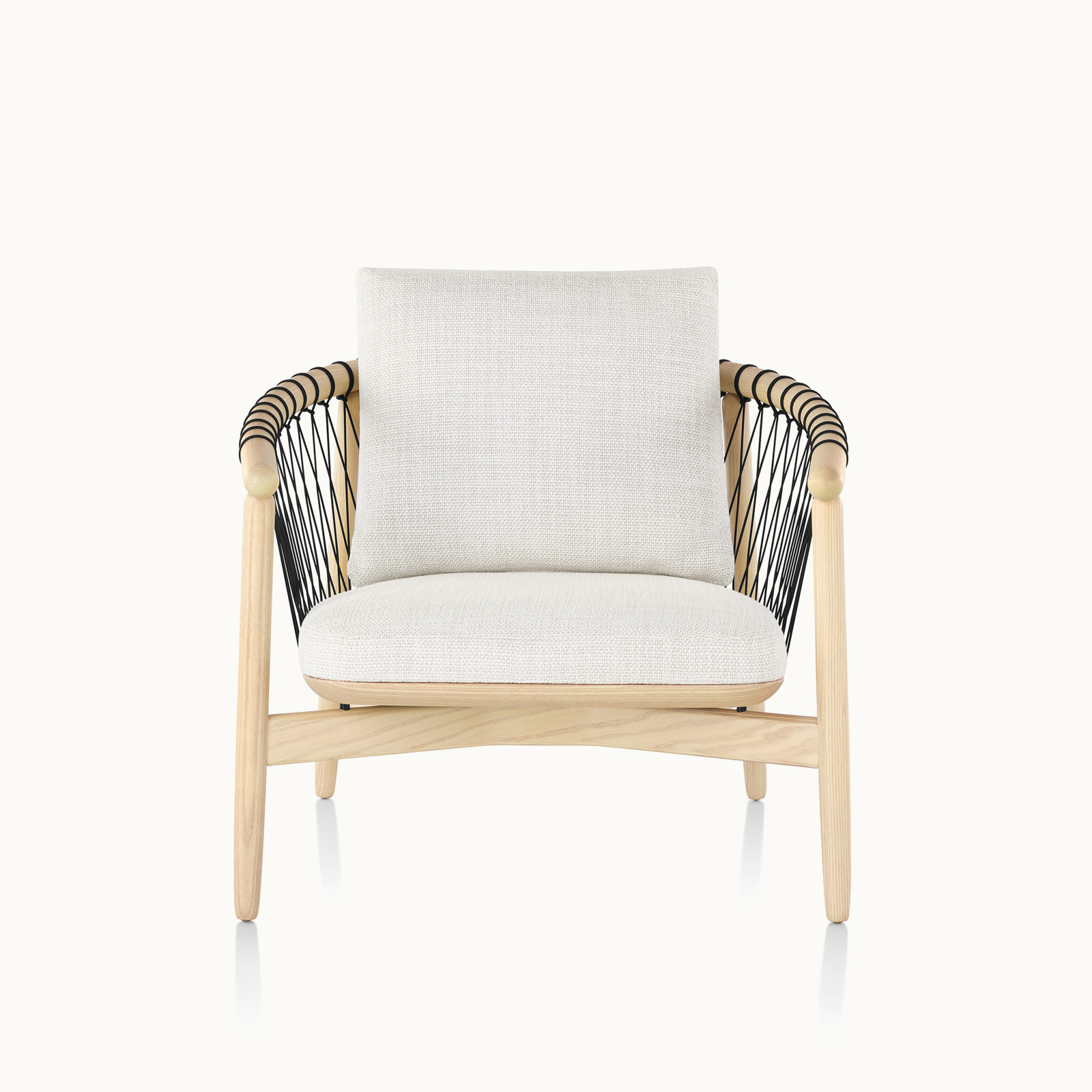 A Crosshatch lounge chair with off-white fabric and a light wood frame, viewed from the front.