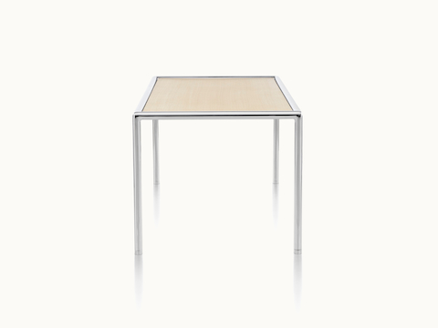 A rectangular Full Round coffee table with a light wood top and tubular metal frame, viewed from the side.