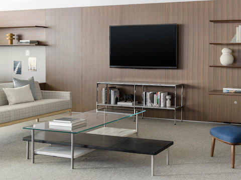 A collaborative lounge furnished with an L-shaped Layer coffee table and plaid Wood Base Lounge Seating.