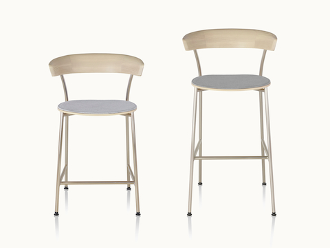 A counter-height Leeway Stool next to a bar-height Leeway Stool, both viewed from the front.