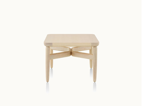 A square Reframe occasional table with a light wood finish.