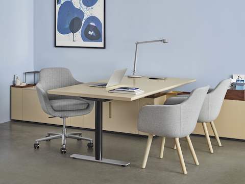 A private office featuring Geiger Rhythm Casegoods, a light gray Saiba office chair, and two light gray Saiba Side Chairs.