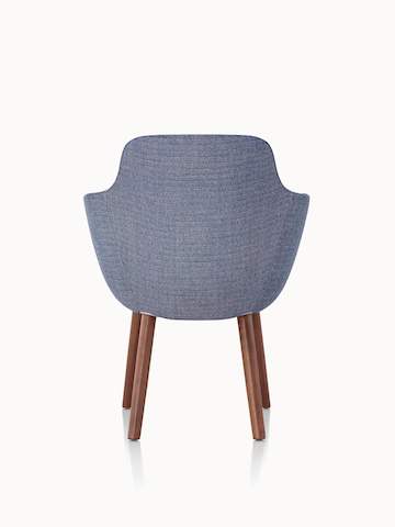 A Saiba Side Chair with blue upholstery and wood legs in a medium finish, viewed from behind.