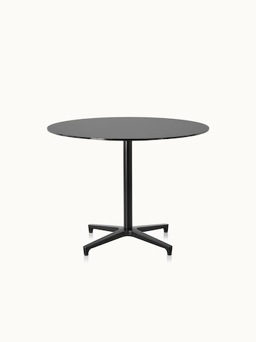 A round Saiba occasional table with a black  top and base.