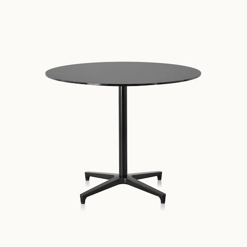 A round Saiba occasional table with a black top and base. Select to go to the Saiba Tables product page.