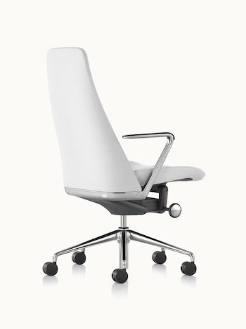 A Taper office chair upholstered in off-white fabric, viewed from behind at an angle.