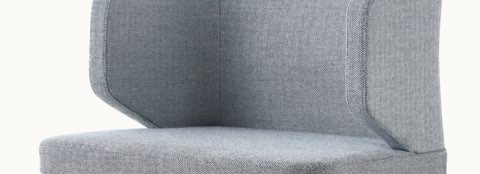 An A Line Chair in ash with steel blue upholstery, viewed from the three-quarter perspective. An A Line Chair in ash with steel blue upholstery, viewed from the three-quarter perspective.