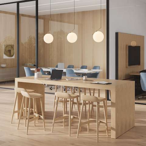 JD Waterfall Table by DatesWeiser meeting table in Oak with Crosshatch Stools and conference rooms in the background.