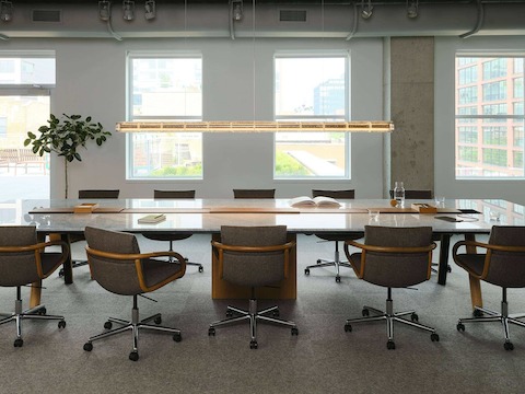 Ascent Conference Table by DatesWeiser with Full Loop Chairs by Geiger, both designed by EOOS, in Carrara Marble and Natural Rift Cut Oak shown in the Geiger DatesWeiser Chicago Showroom.