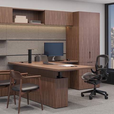Geiger One Private Office in Natural Walnut with Aeron Task and Crosshatch Guest Seating.