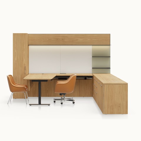A Geiger One Private Office in Natural Flat Cut Oak with an incline edge and Bumper Chairs in camel leather viewed from the front.