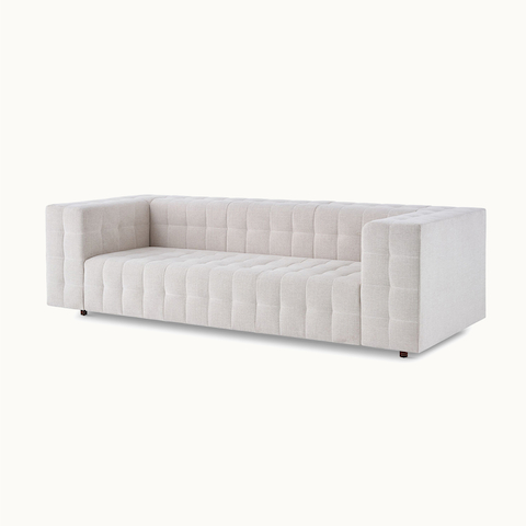 An armless Tuxedo Component Lounge sofa in light gray fabric, viewed from the side.