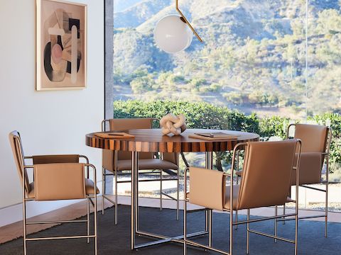 A meeting room with Domino Round meeting table and Envelope Chairs in an environmental setting.