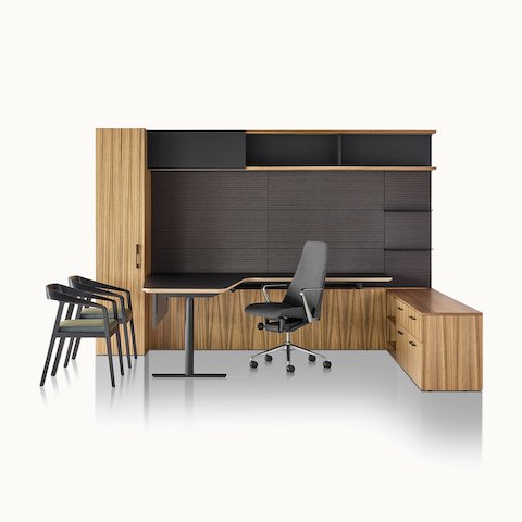 A private office featuring Geiger One Casegoods with a peninsula work surface and storage, a Taper office chair, and two Full Twist Guest Chairs.