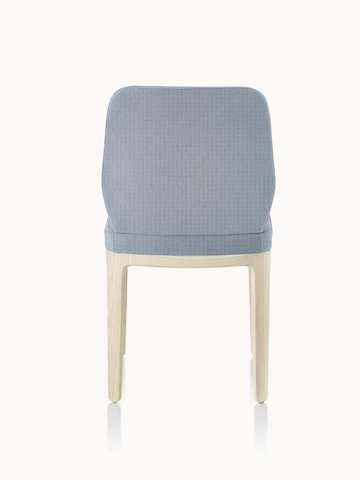 An armless A Line side chair with light gray upholstery, viewed from the back.