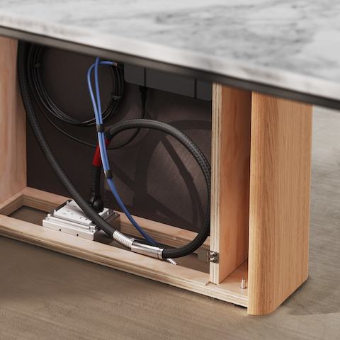 Detail shot of the Ascent Conference Table designed by EOOS for DatesWeiser showing open wire management base.