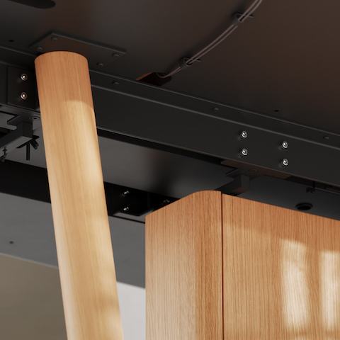 Detail shot of the Ascent Conference Table designed by EOOS for DatesWeiser showing cable management and structure of table’s underside.