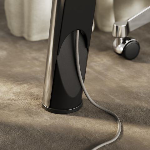 Detail shot of the Ascent Conference Table designed by EOOS for DatesWeiser showing integrated table leg cable management.