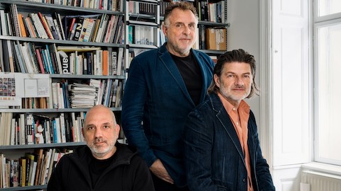 Portrait of the design partners and founders of EOOS—Harald Gründl, Martin Bergmann, and Gernot Bohmann—sitting together in their studio in Vienna, Austria.