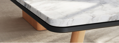 Detail of Ascent Conference Table by EOOS for DatesWeiser showing protective edge in White Carrara marble with natural rift cut oak base viewed at an angle.