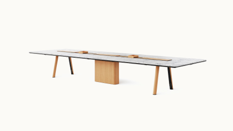 Ascent Conference Table designed by EOOS for DatesWeiser in White Carrara polished marble with natural rift cut oak base shown at an angle on a white sweep. Ascent Conference Table designed by EOOS for DatesWeiser in White Carrara polished marble with natural rift cut oak base shown at an angle on a white sweep.