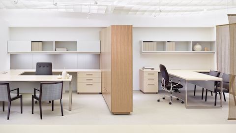 A semi-private office with two City Hall guest chairs next to a semi-private office with two Ascribe guest chairs.