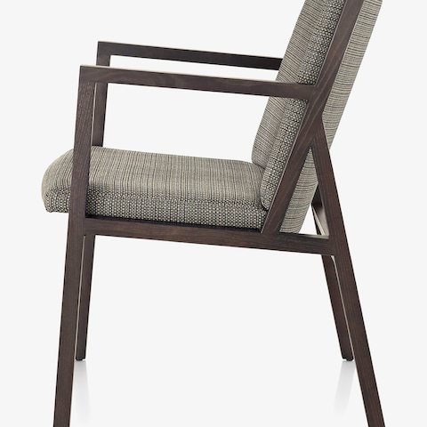 Partial side view of an Ascribe side chair, showcasing the solid wood frame.