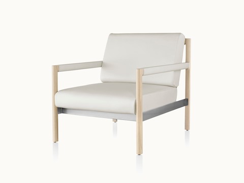 Angled view of a Brabo club chair with off-white leather upholstery, leather and metal accents, and an exposed wood frame.