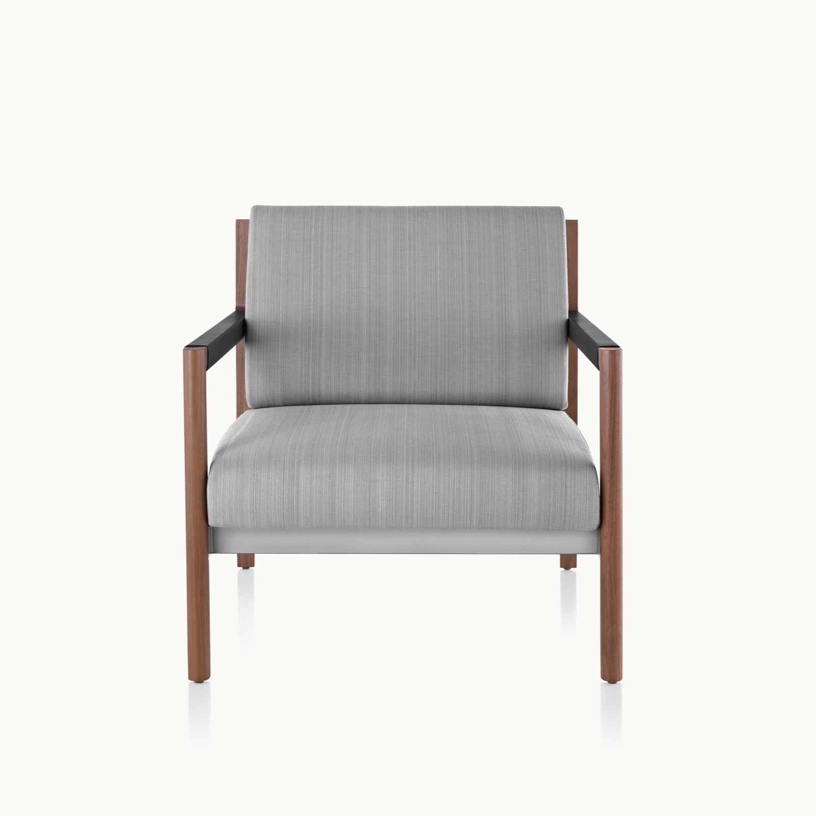 A Brabo club chair with light gray upholstery, leather and metal accents, and an exposed wood frame, viewed from the front.