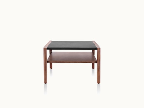 A Brabo Coffee Table with a leather top, wood shelf, and wood frame.