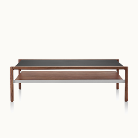A rectangular Brabo coffee table with a black leather-wrapped top, walnut lower shelf, and metal frame supports, viewed from the front.