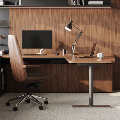 Partial view of a private office furnished with Geiger Rhythm Casegoods and a black leather Taper Chair. Select to go to the Private Office landing page.