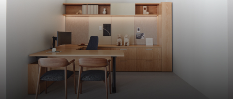 An executive workstation furnished with Geiger Rhythm Casegoods and a black leather Taper Chair. Select to go to the All Casegoods landing page.
