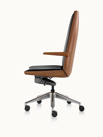A high-back Clamshell office chair with a veneer shell in a light finish, viewed from behind at an angle.