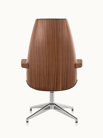 A high-back Clamshell Lounge Chair, viewed from the rear to show the veneer shell.