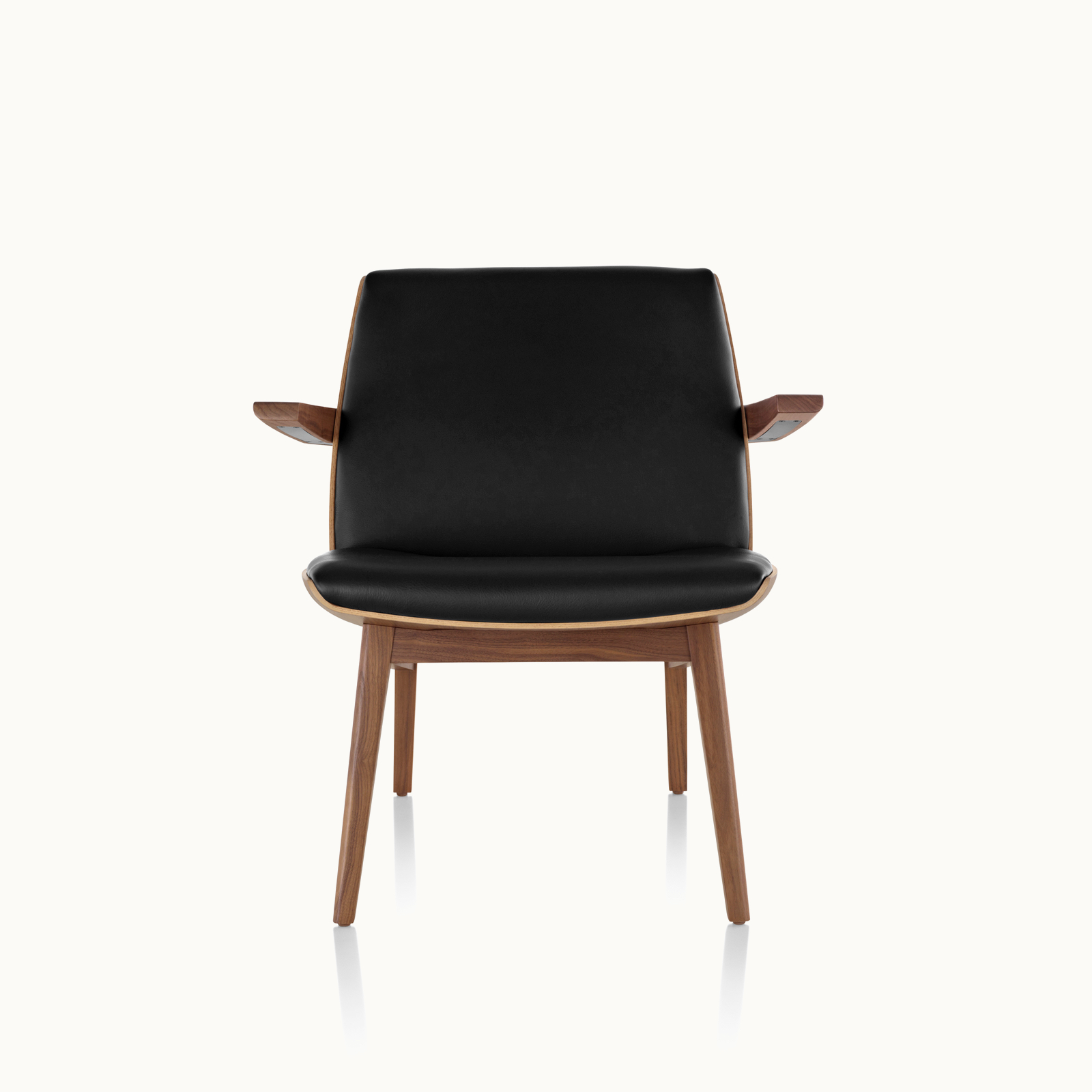 A low-back Clamshell Lounge Chair with black leather upholstery and four wood legs, viewed from the front.
