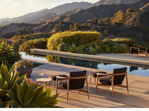 Crosshatch Outdoor Lounge Chairs with Ottomans in an environmental setting by the pool.