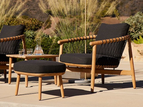 Crosshatch Outdoor Lounge and Ottoman and Square Side Table in an environmental setting.