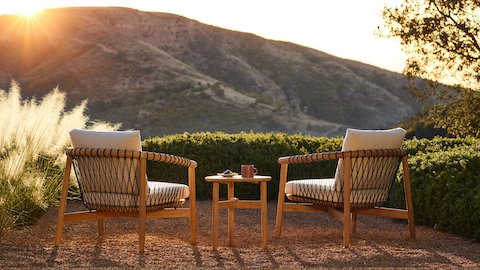 Crosshatch Outdoor Lounge Chairs and Trilobe Side Table in an environmental setting.