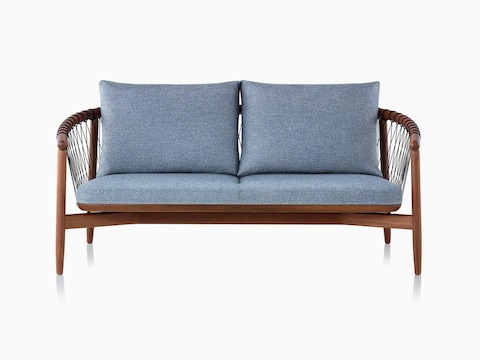 A dark-colored Crosshatch Settee featuring gray upholstery and a walnut frame.