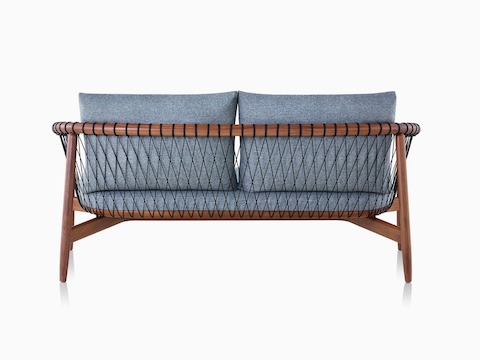 A dark-colored Crosshatch Settee featuring gray upholstery and a walnut frame. Viewed from behind.