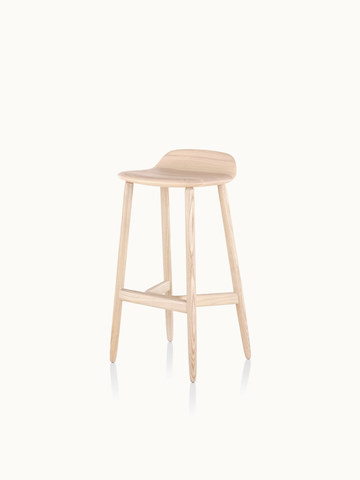 Angled view of a bar-height wood Crosshatch Stool with a light finish.