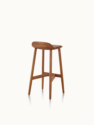 A bar-height wood Crosshatch Stool with a medium finish, viewed from behind at an angle.