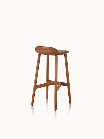 A bar-height wood Crosshatch Stool with a medium finish, viewed from behind at an angle.