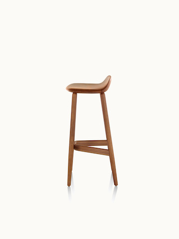 Side view of a bar-height wood Crosshatch Stool with a medium finish.