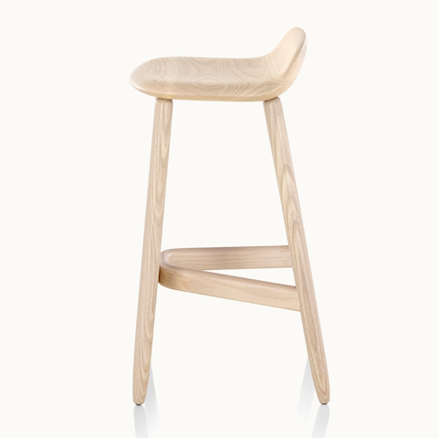 Side view of a wood Crosshatch Stool with a light finish, showing the distinctive frame supports.