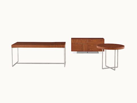 A Domino Table, Domino Desk, and Domino Storage credenza, all with matching wood veneer and metal finishes.