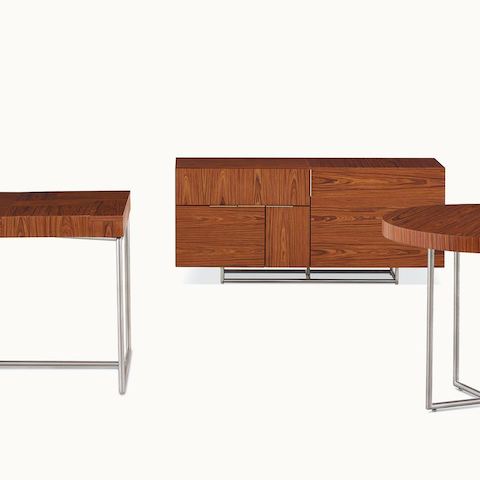 A Domino Table, Domino Desk, and Domino Storage credenza, all with matching wood veneer and metal finishes.