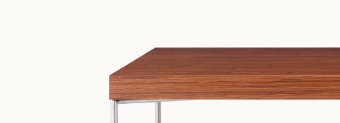 A Domino Desk with wood top and metal base.