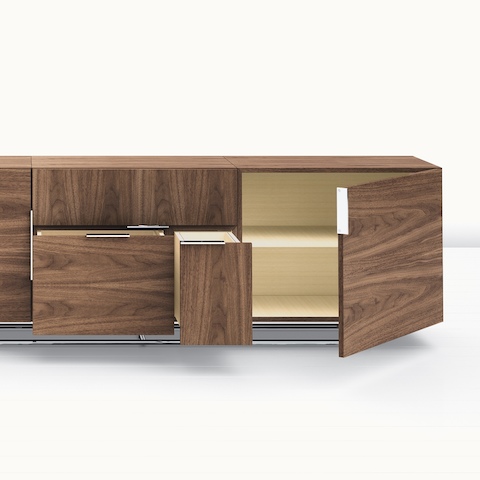Partial view of a Domino Storage credenza with some doors and drawers open.